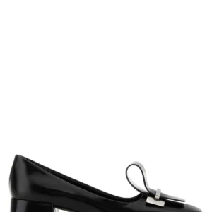 Black leather pumps