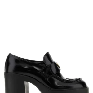 Black leather pumps
